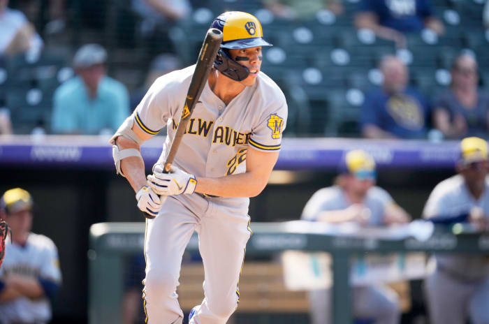 Milwaukee Brewers’ Christian Yelich follows the flight of his RBI-double off Colorado Rockies relief pitcher Justin Lawrence in the eighth inning of a baseball game Wednesday, Sept. 7, 2022, in Denver.